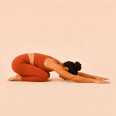 Child's Pose: hips sitting back toward the heels, forehead resting down, body softening.