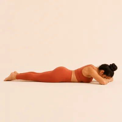 Crocodile Pose: lying face down with the forehead resting on folded arms and the heels falling open.