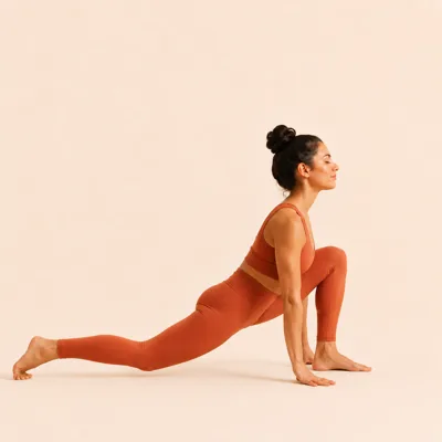 Low Lunge: the right leg stepped far back with the knee lowered to the mat.