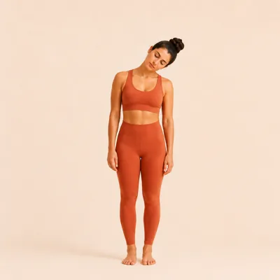 Side bend: the left ear tilting toward the left shoulder, shoulders staying level.